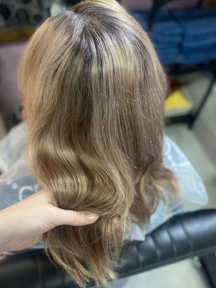 The same hair before coloring: dull, grayish blonde