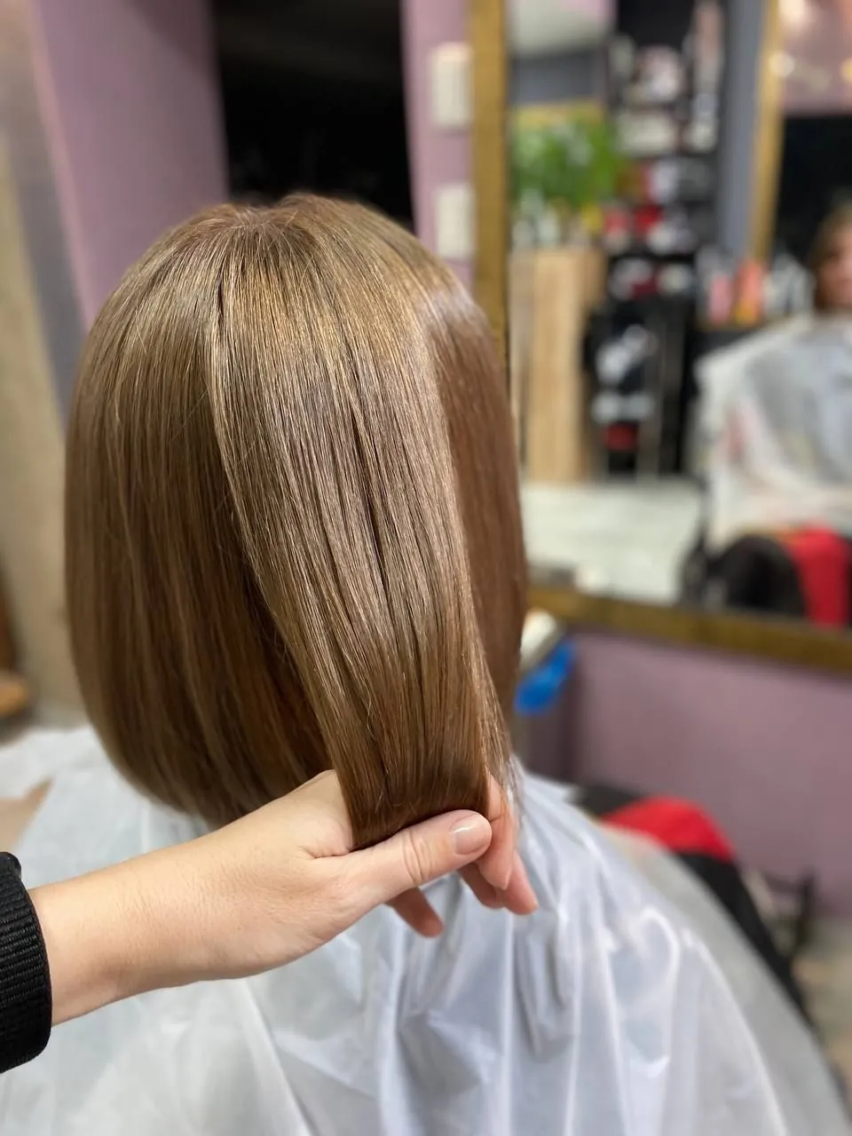 A bob in a natural light-brown shade, seen from behind